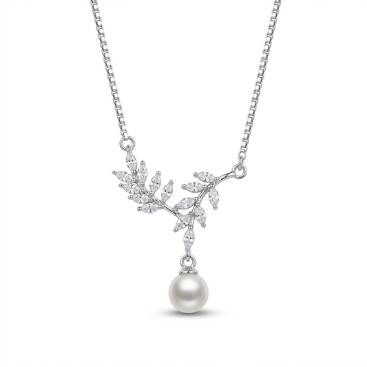 Silver necklace with leaf design and pearl pendant .